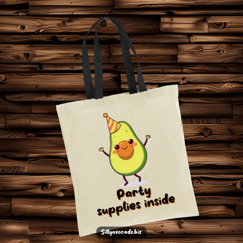 Funny tote bag depicting an avocado character in a tiny party hat, doing a silly dance with festive energy.